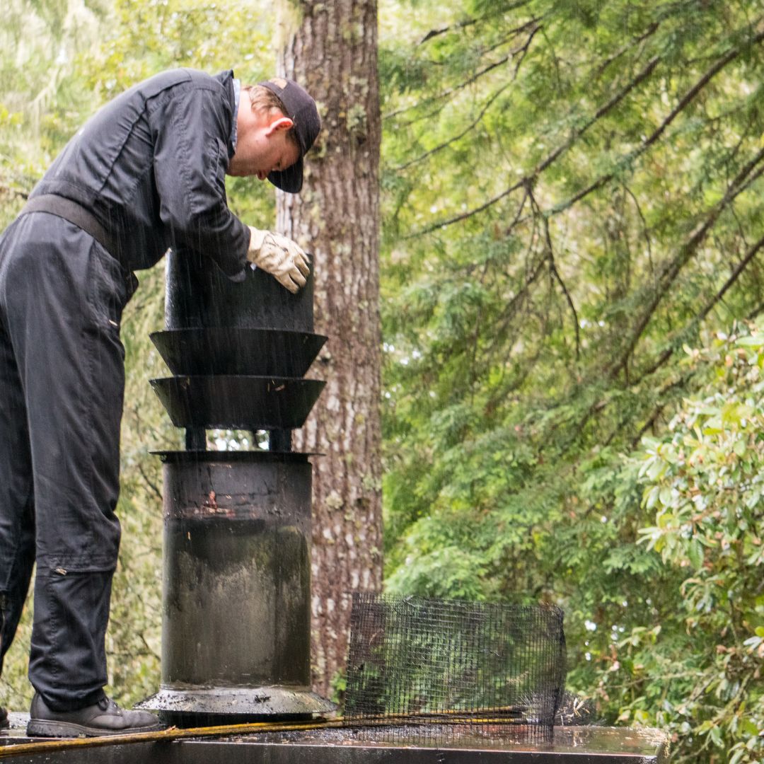 Ventora technician inspecting a clean chimney cap after service